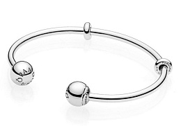Silver open bangle with silicone stoppers and inte